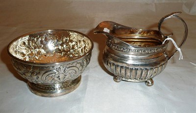 Lot 364 - Silver cream jug and an embossed bowl