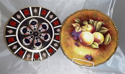 Lot 372 - A Coalport plate painted with fruit by N B Higgins, also a Royal Crown Derby Imari plate