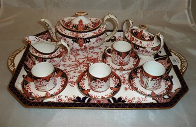 Lot 384 - A Royal Crown Derby Imari tete-a-tete comprising teapot, sucrier, milk jug, four cups and...