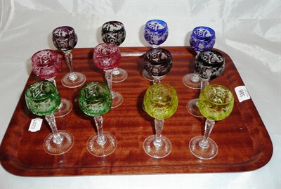 Lot 386 - A set of twelve coloured Bohemian sherry glasses