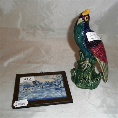 Lot 410 - Blue and white pottery framed tile 'Parting of the Sea' and a Hancock pottery bird (2)