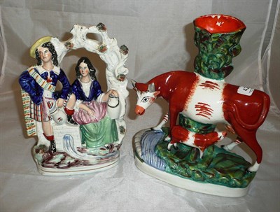 Lot 422 - A Staffordshire cow and calf group and a Staffordshire Arbour group