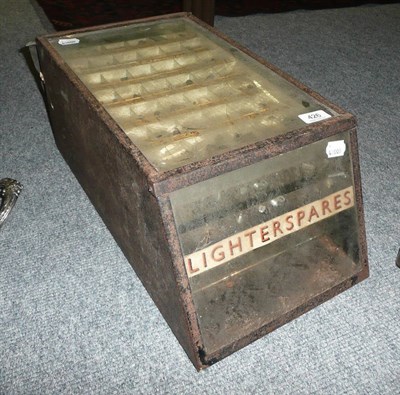 Lot 426 - A glazed metal lighter spares six drawer cabinet with lighters