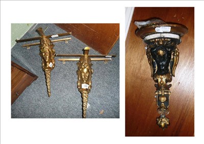 Lot 446 - A pair of gilt bronze shelf brackets of classical females and another wall bracket (3)