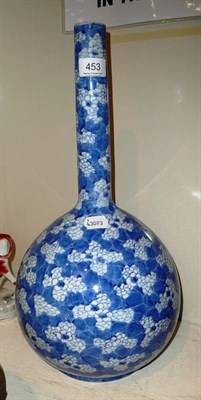 Lot 453 - A Japanese porcelain blue and white shaft and globe vase, circa 1900