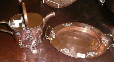 Lot 469 - Embossed copper watering can and a similar tray