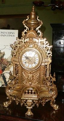 Lot 477 - An ornate French brass mantle clock