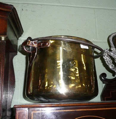 Lot 487 - Copper and brass pot with swing handle