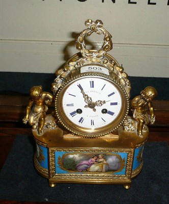 Lot 503 - French porcelain and ormolu clock