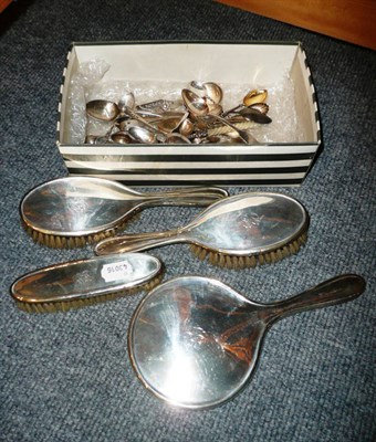 Lot 512 - Silver-mounted four piece dressing table set and assorted silver and plated teaspoons, etc