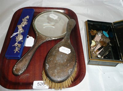 Lot 526 - A silver brush and hand mirror, a silver charm bracelet hung with ten charms and two loose and...