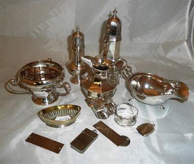 Lot 543 - Quantity of silver, two silver sugar casters, sauce boat, name tag, cream jug, small Art...