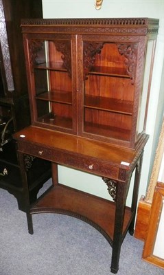 Lot 624 - A mahogany fret cut display cabinet on stand, the drawer stamped 03528