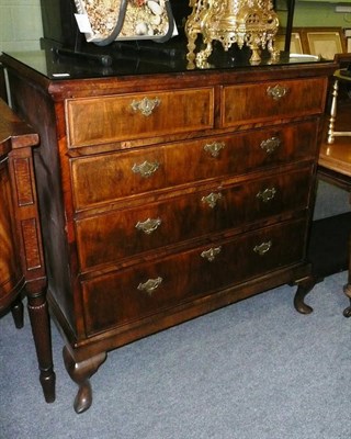 Lot 632 - A George II and later walnut cross-banded chest of drawers