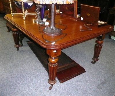 Lot 633 - Victorian mahogany wind-out dining table with two leaves and handle