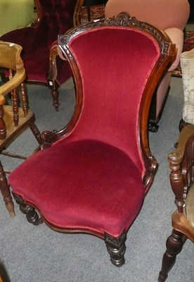 Lot 644 - A carved walnut nursing chair