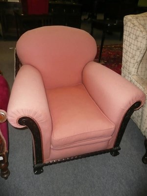 Lot 647 - A pink upholstered carved oak framed armchair