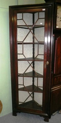 Lot 664 - Mahogany glazed floor standing corner cupboard