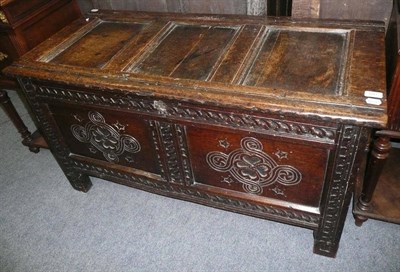 Lot 691 - Charles I oak coffer panelled top above fielded carved panels on stile feet