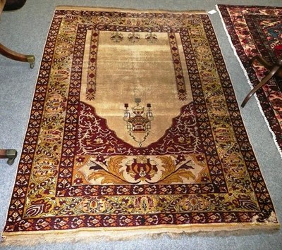 Lot 700 - A hand woven prayer rug