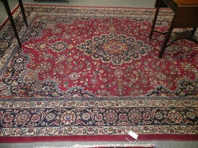 Lot 702 - A Persian pink ground floral carpet