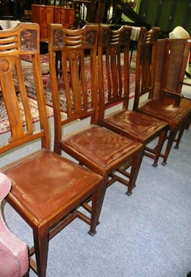 Lot 724 - A set of four carved oak Arts & Crafts dining chairs, stamped AA underneath