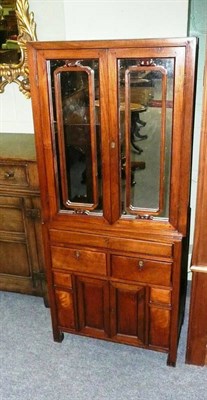 Lot 733 - A Chinese hardwood dwarf cabinet on stand