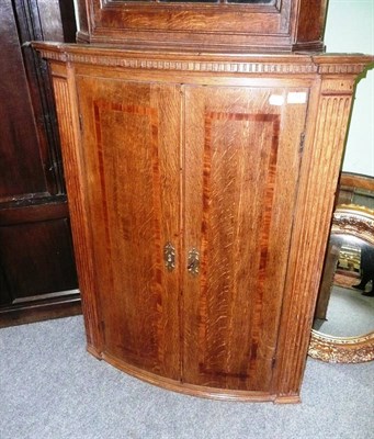 Lot 744 - George III oak hanging corner cupboard