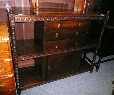 Lot 748 - A carved oak buffet with later central drawers and cupboard