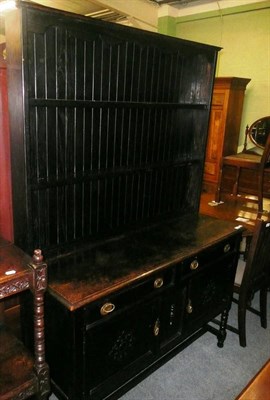 Lot 750 - An oak dresser and plate rack