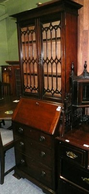 Lot 752 - An early 20th century bureau bookcase with Arts & Crafts handles