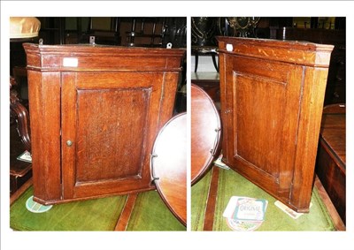 Lot 776 - Matched pair of oak small wall hanging corner cupboards