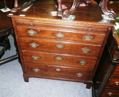 Lot 779 - George III oak chest with brushing slide