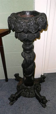 Lot 785 - A carved Burmese hardwood plant stand