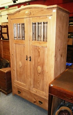 Lot 848 - A glazed pine cupboard