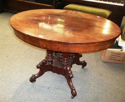 Lot 939 - A 19th century Continental mahogany draw-leaf dining table on five turned pillars and quadruped...