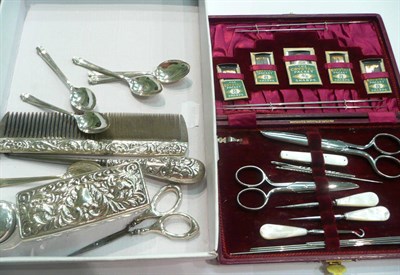 Lot 18 - Leather-cased hinged sewing set, silver-mounted rectangular glass display dish, silver scissors and