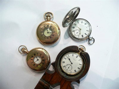 Lot 23 - Three silver plated pocket watches, a silver pocket watch and an olivewood pocket watch holder