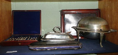 Lot 25 - A silver plated breakfast dish, entree dish, a pair of pepperettes, two canteens of cutlery and...