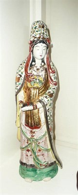 Lot 29 - Japanese earthenware and enamelled figure of Guanyin, Goddess of Mercy, circa 1910-20