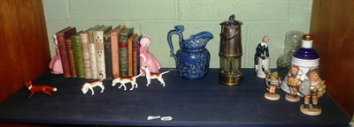 Lot 33 - A Beswick fox and three hounds, three Hummel figures, miner's lamp, decorative bindings and an...