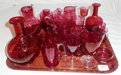 Lot 62 - A collection of 19th century and later cranberry glass jugs, salts, glasses, etc