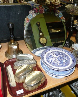 Lot 83 - Quantity of silver-backed brushes, blue and white comports, a brass bell and a Barbola mirror