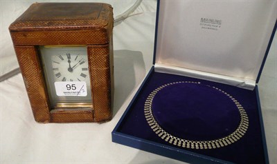 Lot 95 - A brass carriage clock with case and a Stirling silver necklace