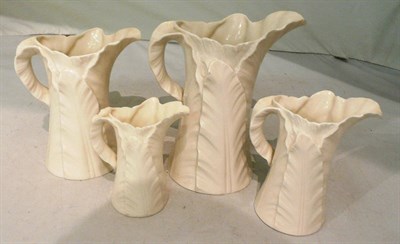 Lot 115 - Four Royal Worcester leaf-decorated graduated jugs