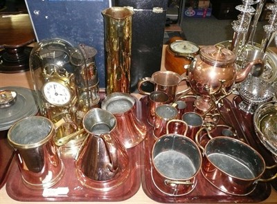 Lot 129 - Two trays of brass and copper including spirit kettles, a clock under shade, miner's lamp, etc