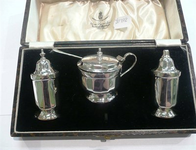 Lot 154 - A three piece silver condiment set