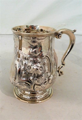 Lot 204 - A chased silver mug, 8oz approximate weight