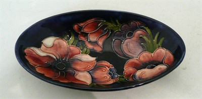 Lot 211 - A Walter Moorcroft 'Anemone' dish