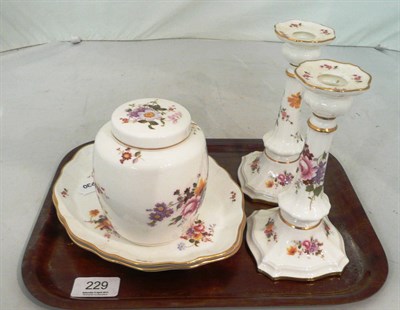 Lot 229 - A pair of Royal Crown Derby 'Derby Posies' candlesticks, two shaped dishes, a caddy and cover (5)